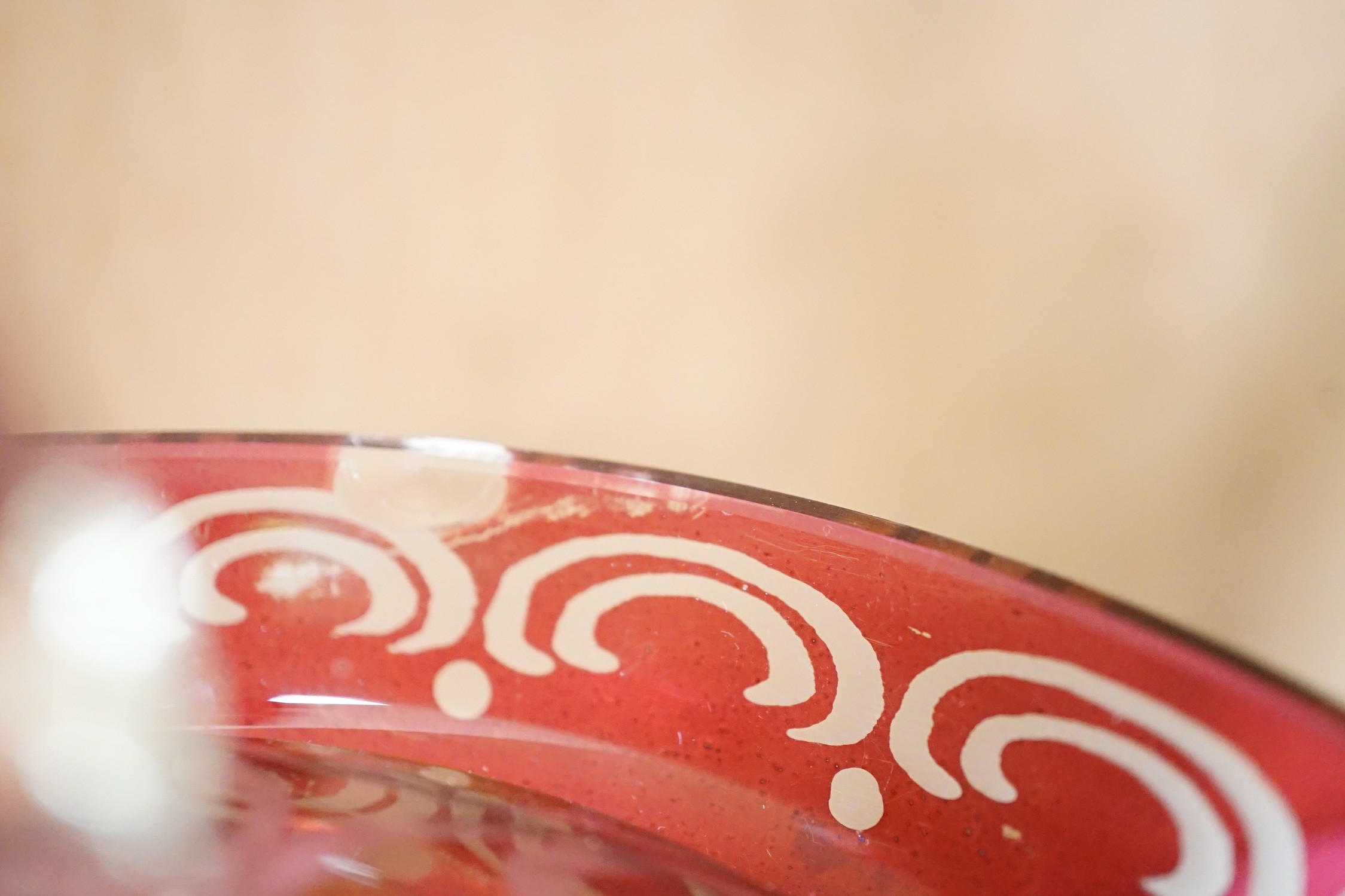 A collection of cranberry glass, a dump paperweight, another and a sweetmeat jar, tallest 28.5 cm
